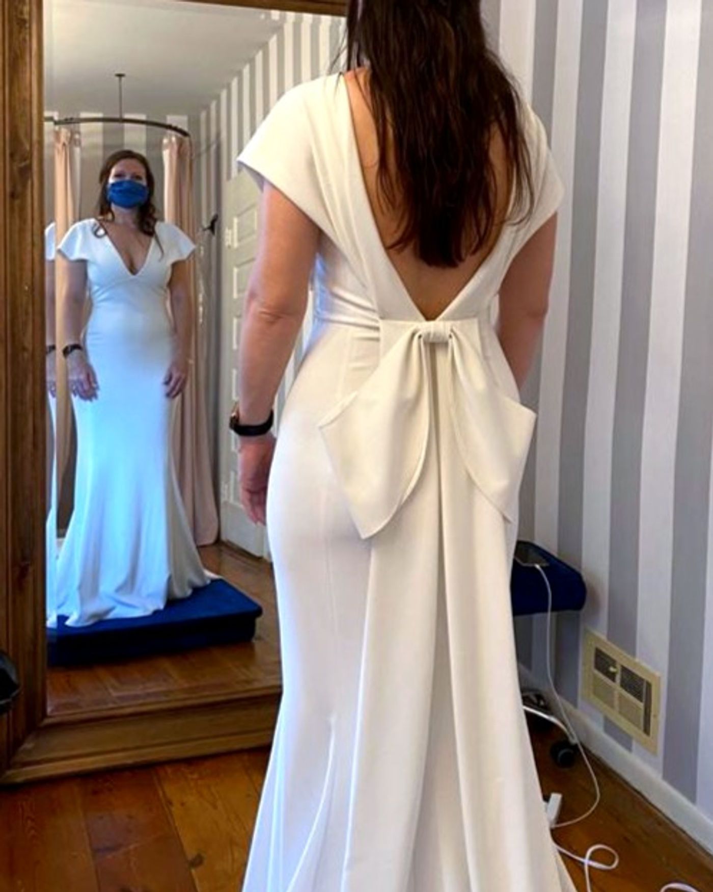 Custom fingertip veil with lace appliqué matched to the bride’s wedding gown