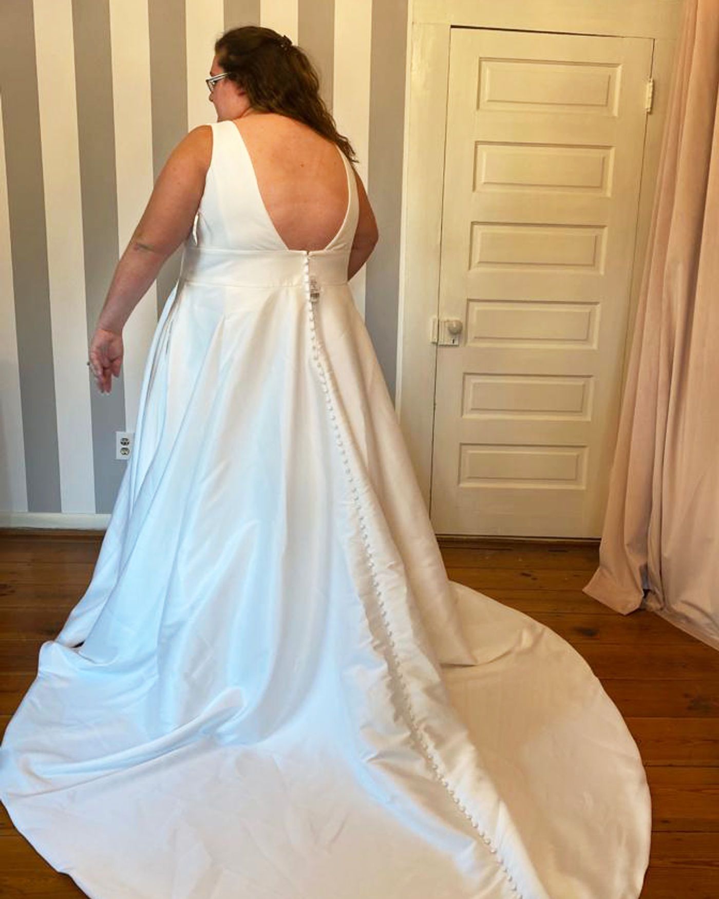 Illusion button back finished by hand on a fitted lace wedding gown, Sandy Springs, Georgia