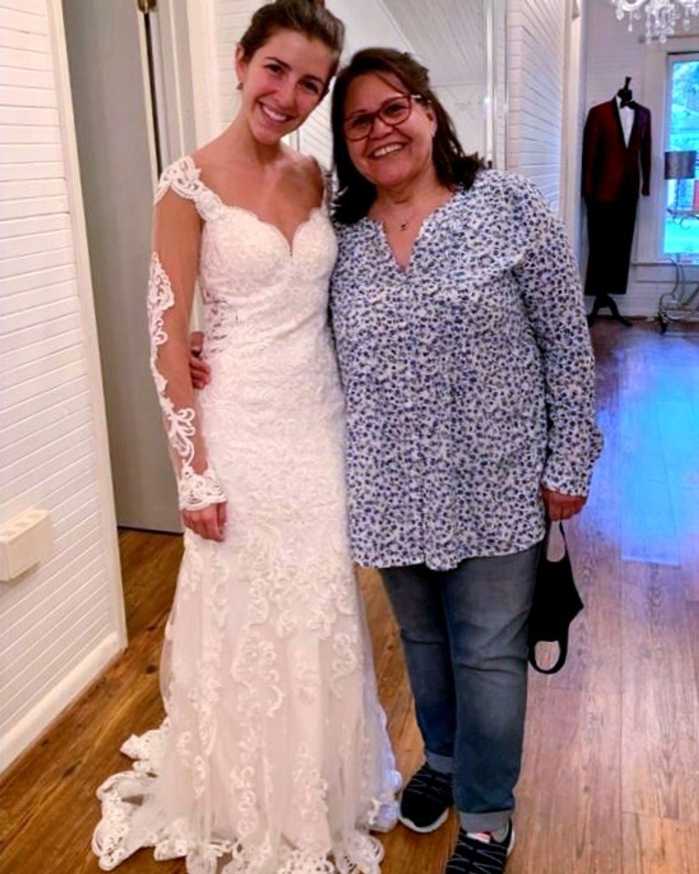 Sweetheart neckline reshaped to a straight neckline on a satin wedding gown